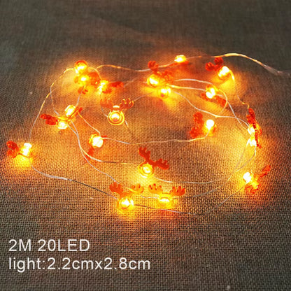 Illuminate Your Holidays with 2M 20LED Warm White Christmas String Lights Featuring Santa Claus, Snowflakes, and Snowman Designs for Festive Home Decor